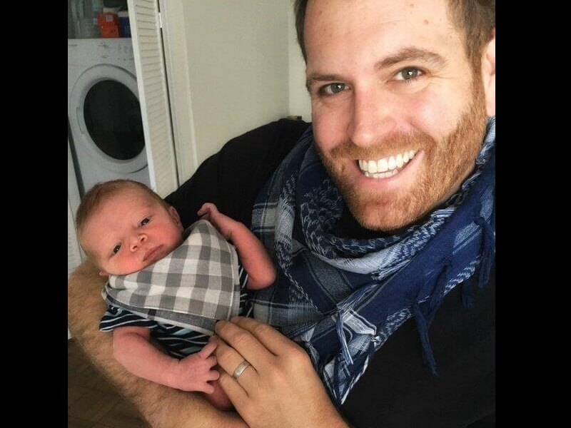 Image of Josh Gates with his newborn son, Owen Gates