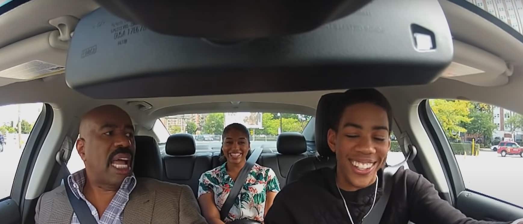 Image of Wynton Harvey with his sister and father, Steve Harvey in a car