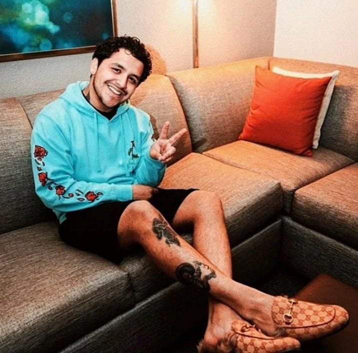 Image of Christian Nodal's leg tattoos